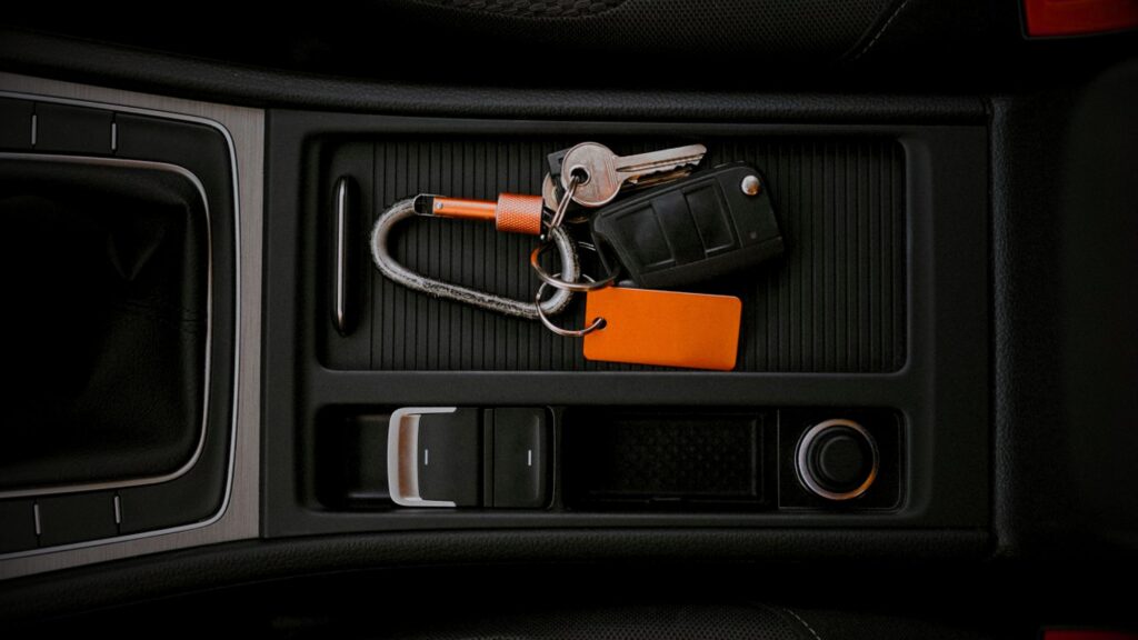 Keys inside a car console box symbolizing; protect your vehicle with advanced car security measures
